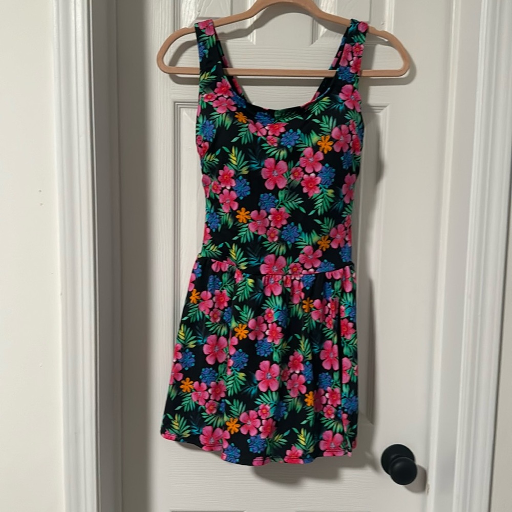 Beautiful swim dress with split skirt and attached boy shorts.